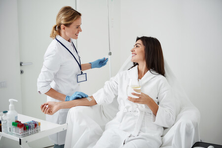 Woman receiving IV drip infusion.