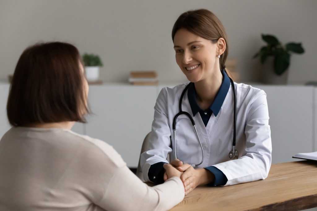 Functional medicine doctor happy patient handshake