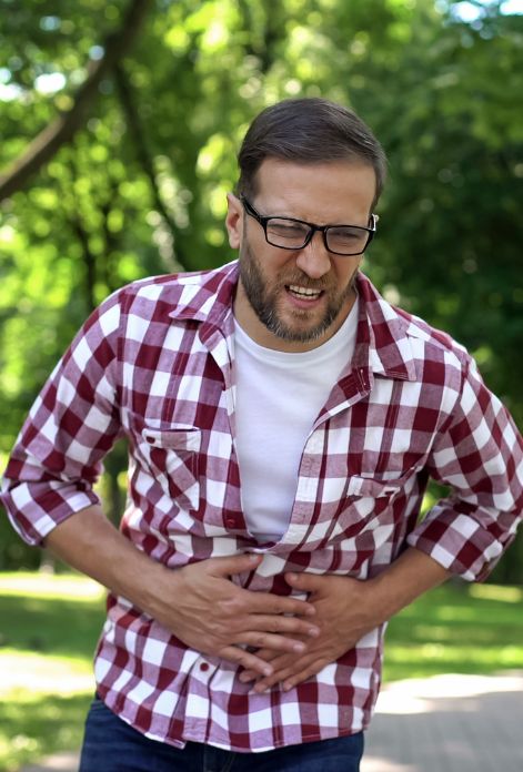 Man suffering from stomach pain parasite testing
