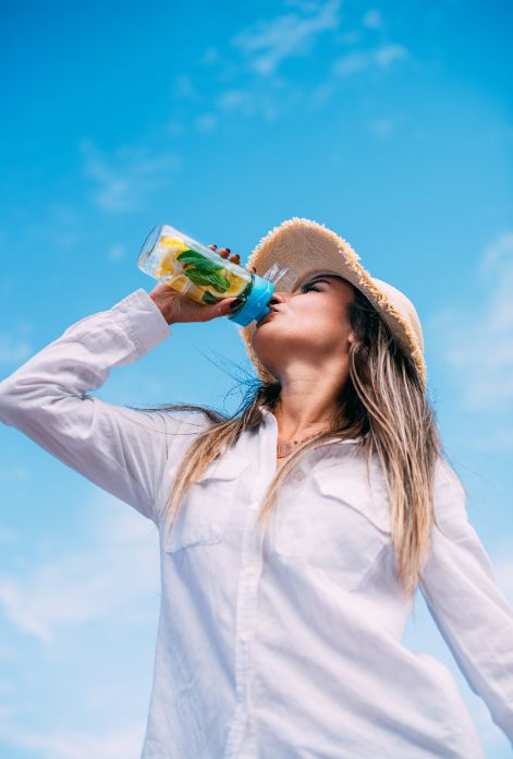 Woman drinking detox beverage