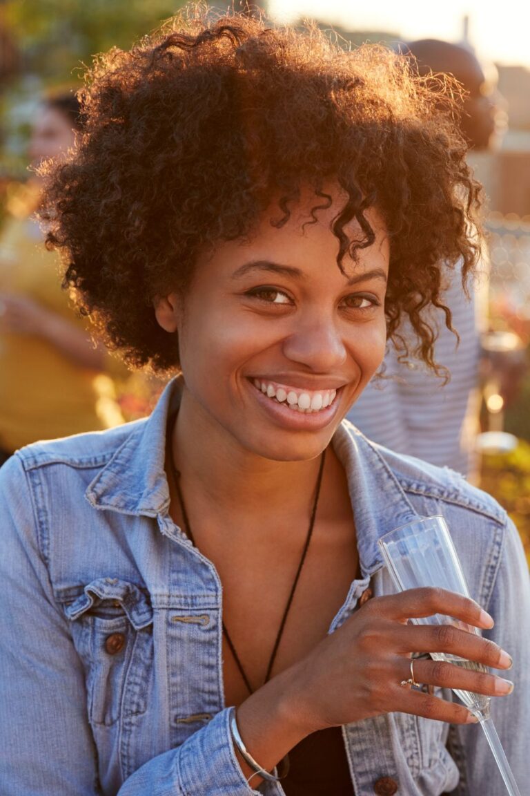 A smiling woman, radiating health and happiness after successful perimenopause treatment.