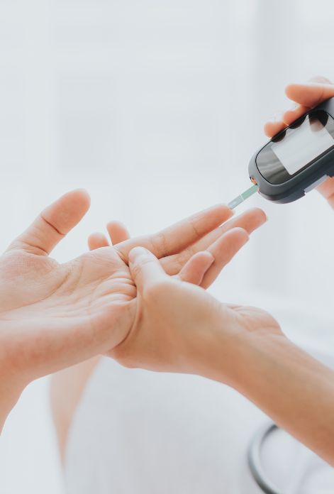 A close-up of a hand using a glucometer to check blood sugar levels, a crucial aspect of managing Type 2 diabetes.