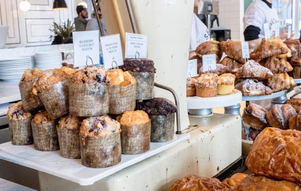 Fresh gluten-free pastries and muffins at Tatte Bakery, a popular destination for gluten-free breakfast Boston locals love.